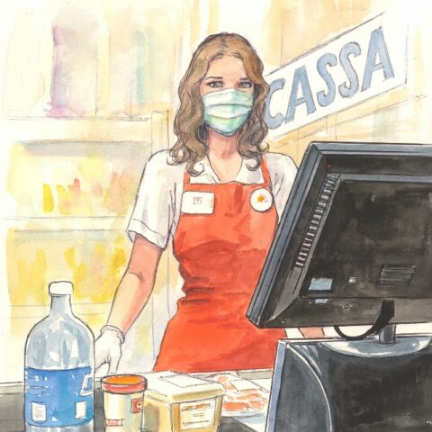 Cassiera al supermercato con mascherina